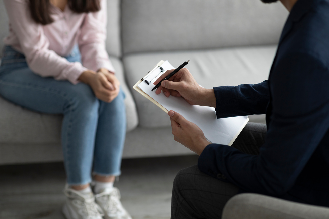 Professional Psychological Help Concept. Unrecognizable Female Patient Talking to Psychotherapist at Office